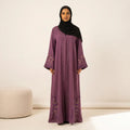 Dusty mauve spiral stone trail vine embroidered corner abaya — full standing front view with black hijab